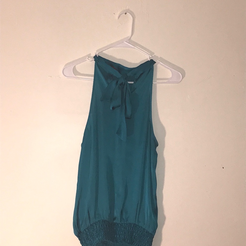 Sleeveless turquoise blouse